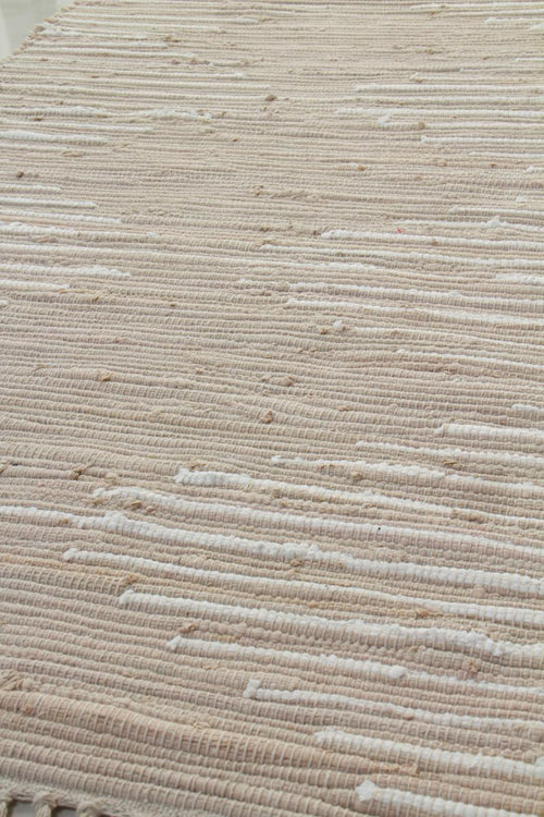 Detalle de la alfombra de algodón beige, unidad 1